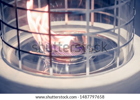 Modern bio fireplot fireplace on ethanol gas. Flame gas stove close-up. Smart ecological alternative technologies. Contemporary biofuel on ethanol. Energy saving innovation. Interior inside house