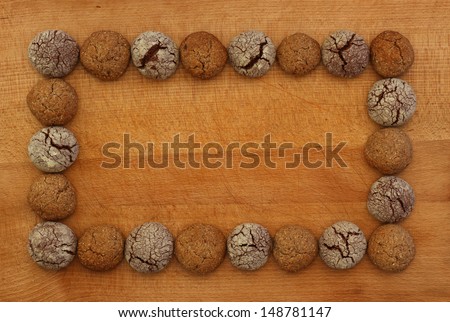 Chocolate and Hazelnut cookies frame on wooden board, copy space