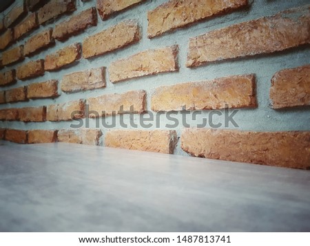 Empty wooden table and Brick  block background with space.Empty for product display. Ready for product display montage. Fair in blurred and de-focus, Soft focus,Select focus