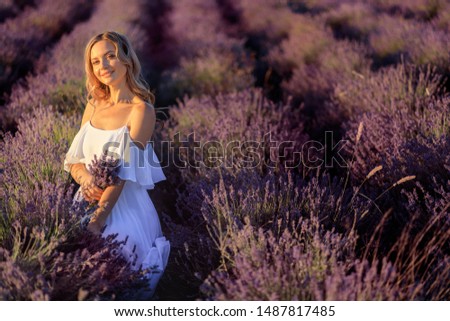 Beautiful girl on the lavender field. Beautiful woman in the lavender field on sunset. - Image 