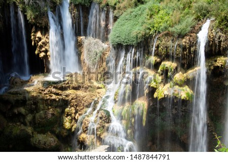 beautiful waterfall photo background, rocky field