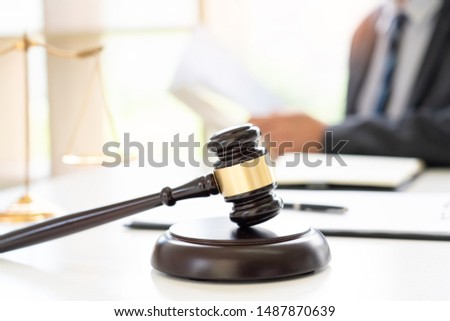 hard work of lawyer judge or attorney working assist client in court with gavel with Justice scale in private office, legal legislation concept