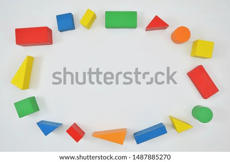 Colorful wooden blocks and building kit frame on white background. Top view mockup with copy space for your text
