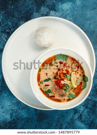 
Tom Yam soup on a blue background