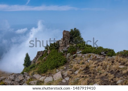 Mountains peaks clouds hiking tourism
