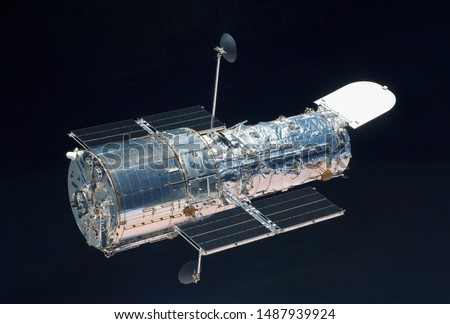 Space Telescope, on a dark background.  Elements of this image were furnished by NASA Royalty-Free Stock Photo #1487939924