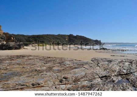 Coastal beach view with rock formations and rock pools at South Valla Beach, Valla Beach, New South Wales, Australia