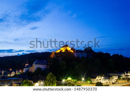 View of Blankenheim Castle in the evening. Blankenheim Castle (German: Burg Blankenheim) is a schloss above the village of Blankenheim in the Eifel mountains of Germany.