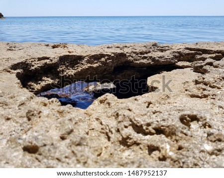 Relief of the rocky coast of the black sea the Republic of Crimea on a Sunny summer cloudless day