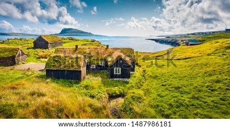 Sunny morning view of typical turf-top houses. Panoramic summer scene of outskirts of Torshavn city, capital of Faroe Islands, Kingdom of Denmark, Europe. Traveling concept background.
 Royalty-Free Stock Photo #1487986181