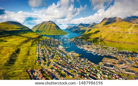 View from flying drone. Sunny summer cityscape of Klaksvik town. Aerial morning scene of Bordoy island, Faroe, Kingdom of Denmark, Europe. Traveling concept background.
 Royalty-Free Stock Photo #1487986196