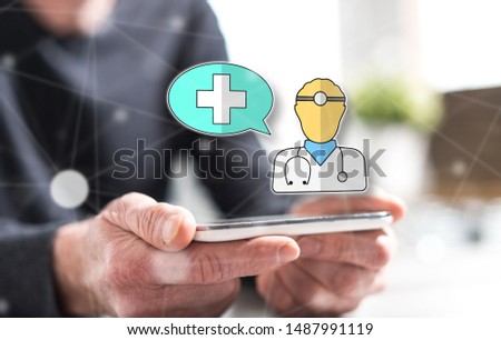 Hands of man holding a smartphone with medical support concept