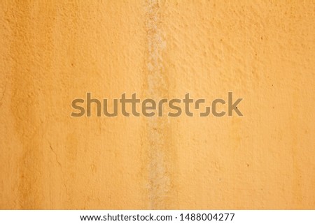 Faded Yellow Textured wall for background and design