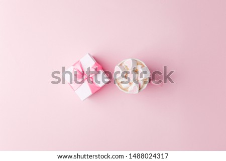 White gift box and cup of coffee on pink background with copy space for text. fashion and shopping concept. wedding, marriage or birthday composition. 