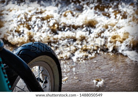 bicycle wheel on the background of the river