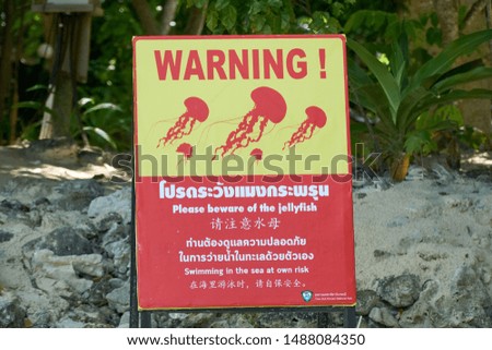   Beware of jellyfish warning signboard in Krabi, Thailand                             
