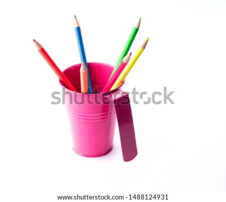 Colorful pencils in pail isolated on white. Creative idea for drawing and style.