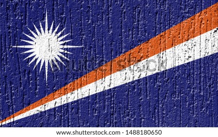 Flag of Marshall Islands close up painted on a cracked wall