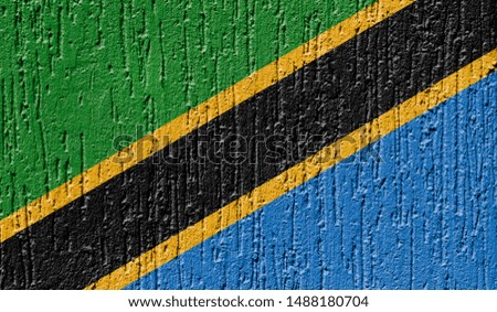 Flag of Tanzania close up painted on a cracked wall