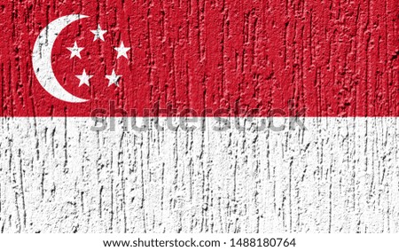 Flag of Singapore close up painted on a cracked wall