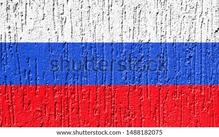Flag of Russia close up painted on a cracked wall