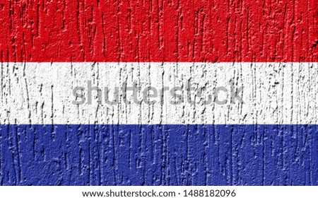 Flag of Netherlands close up painted on a cracked wall