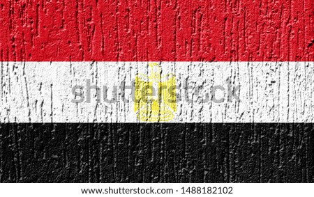 Flag of Egypt close up painted on a cracked wall
