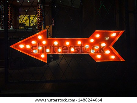Left arrow lighted; decorative sign; lighted sign
