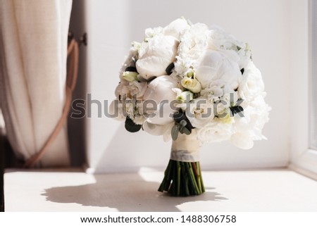 white bride's bouquet. bouquet with peonies, peony rose and freesia