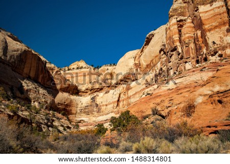 View of rocky hillside and a side canyon along calf creek trail, Grand Staircase-Escalante National Monument, Utah Royalty-Free Stock Photo #1488314801