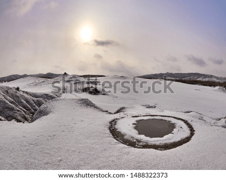 landscape with muddy volcanoes from Berca region, Buzau county, Romania  in winter - aerial view