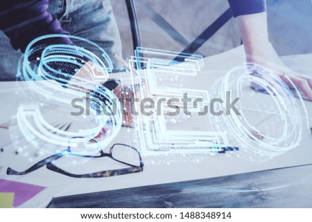 Man hands writing. With double exposure seo drawings.