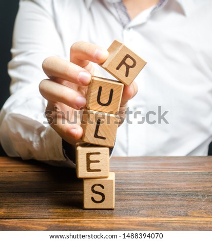 A man breaks the rules. Moral and ethical violations. Go against the law and system, non-recognition of the code of honor. Loopholes laws. Unreliable and dishonest business partner. Unprofessionalism Royalty-Free Stock Photo #1488394070