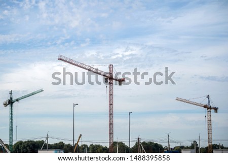 construction cranes, blue sky background
