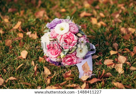 autumn wedding bridal bouquet in the park