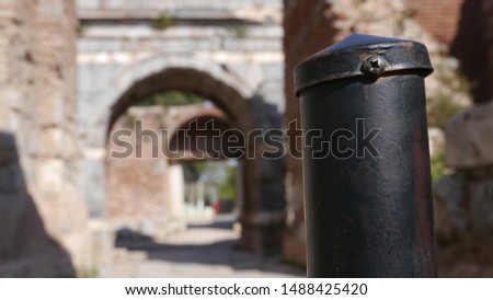 black iron pipe close up shoot and background objects