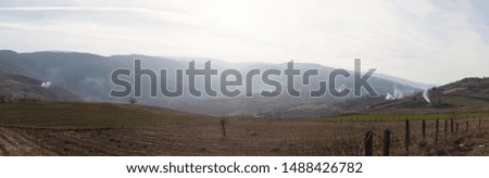 Panorama over idyllic rural landscape golden sunset green pasture