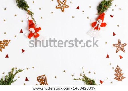 Flat pattern with red christmas decoration, gingerbread and conifer branches on white background.