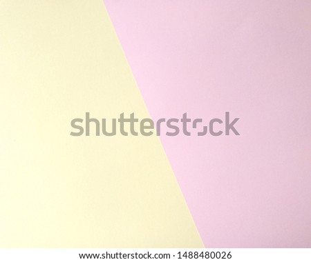 Multicolored pastel yellow pink paper geometric background with photo frame. Copy space for your text