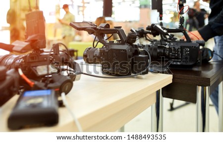 Behind the scenes of filming movies and video products, setting up equipment for shooting video and sound. The concept of producing video content for social networks, TV and blogs.
