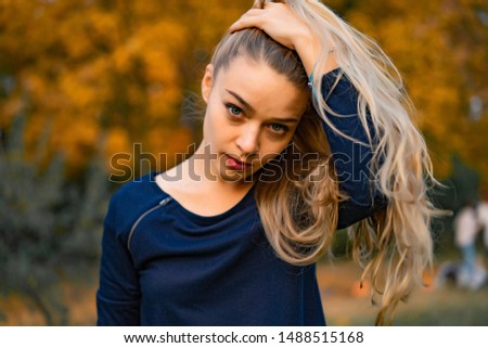 girl walks in the autumn park. female in the autumn forest.