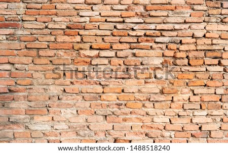 Brick wall texture background in rural room with weathered stained old crack aged pattern. Grunge rusty blocks of stonework red color architecture abstract background and wallpaper

