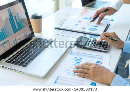 businessman in meeting analysis chart graphy marketing plan in business financial  audit project. Or Business adviser analyzing Budget. Royalty-Free Stock Photo #1488589190