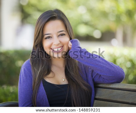 Happy Mixed Race Female Student Portrait on School Campus Bench.