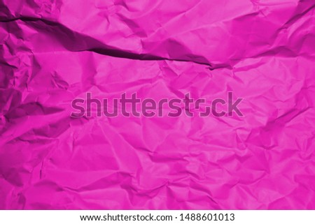 Crumpled recycle pink paper background - Pink paper crumpled texture - Pink paper wrinkled background - The background design concept of paper is pink.