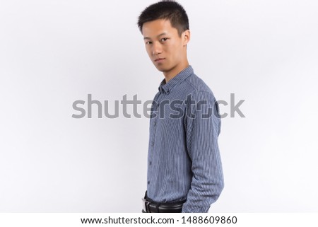 Young Chinese business male in front of white background
