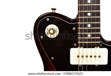 part of a six string electric guitar with switch and pickup