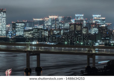 Panoramic modern city skyline bird eye aerial view of Tokyo bay under rainy night