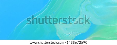 photography of abstract marbleized effect background. Blue, mint and white creative colors. Beautiful paint. banner