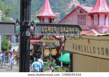 Lower Bazaar road sign / street name. The road is located in the center of Shimla, the capital city of Himachal Pradesh, India.  Most major places of Shimla are connected through the Ridge.